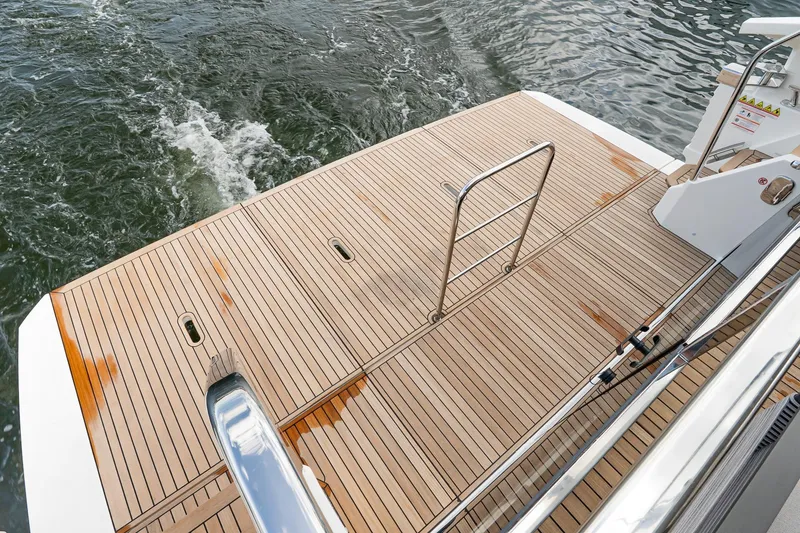 Slide: The Image of Teak deck of 2026 Absolute 60 Fly yacht with stainless steel ladder. - 4