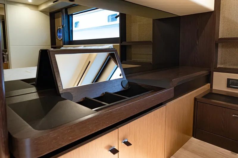 Slide: The Image of Luxurious interior of 2026 Absolute 60 Fly yacht with elegant wood finishes and mirror. - 41