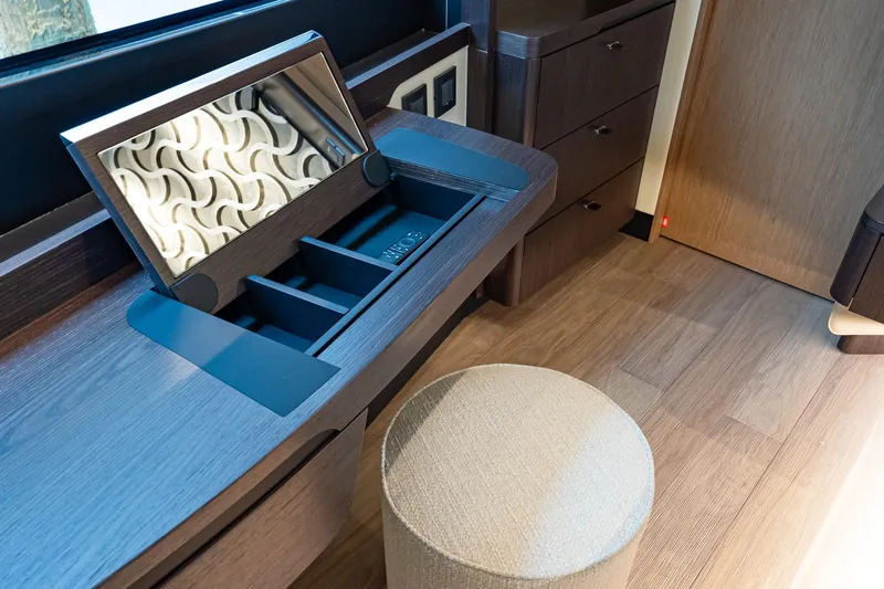 Slide: The Image of Luxurious vanity area in 2026 Absolute 60 Fly yacht with mirror and storage compartments. - 42