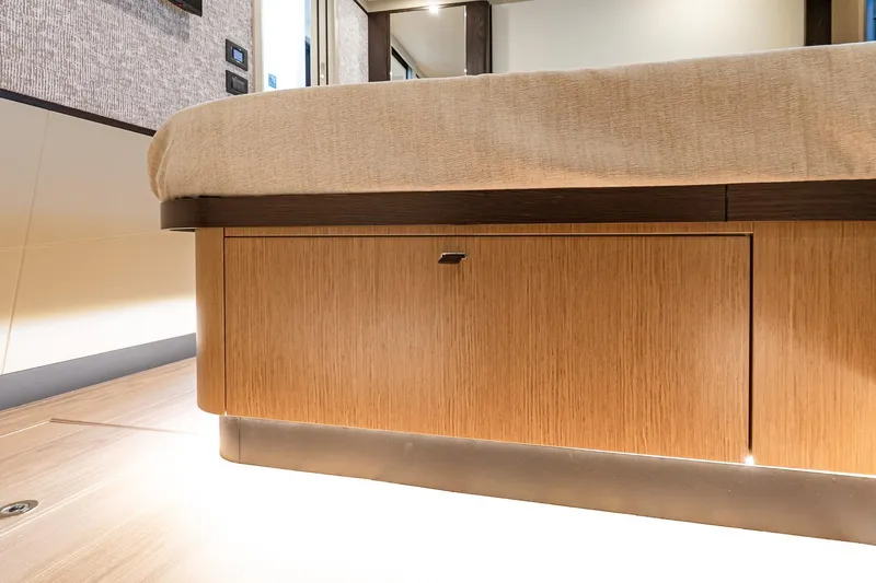 Slide: The Image of Luxurious interior of 2026 Absolute 60 Fly yacht, featuring elegant wood cabinetry and modern design. - 43