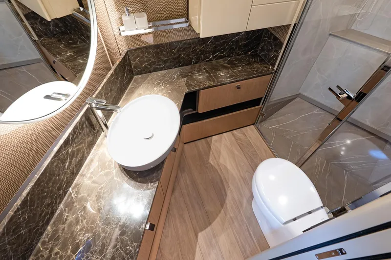 Slide: The Image of Luxurious bathroom in 2026 Absolute 60 Fly yacht with marble countertop and modern fixtures. - 46