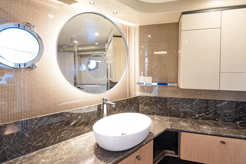 Slide: The Image of Luxurious bathroom interior on 2026 Absolute 60 Fly yacht with modern fixtures and elegant design. - 47