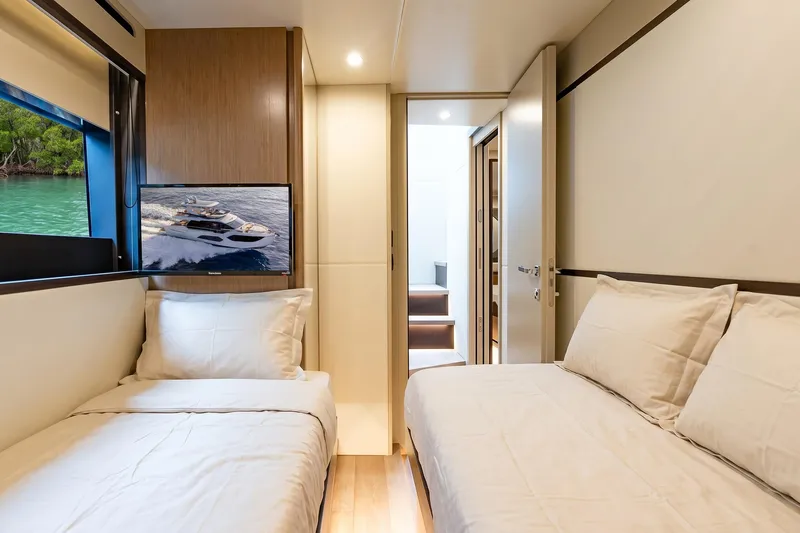 Slide: The Image of Luxurious interior of 2026 Absolute 60 Fly yacht with twin beds and modern decor. - 48