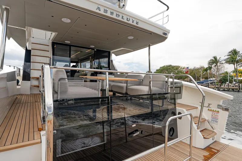 Slide: The Image of Luxurious 2026 Absolute 60 Fly yacht with elegant deck and modern seating area. - 5