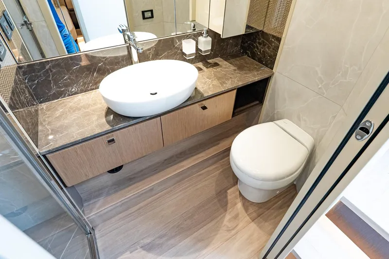 Slide: The Image of Luxurious bathroom in 2026 Absolute 60 Fly yacht with modern fixtures and elegant design. - 50