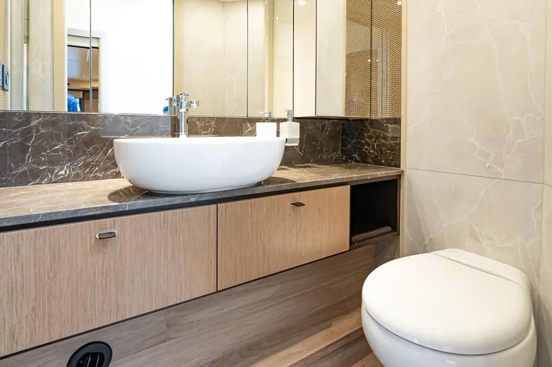 Slide: The Image of Luxurious bathroom in 2026 Absolute 60 Fly yacht with modern fixtures and elegant design. - 51