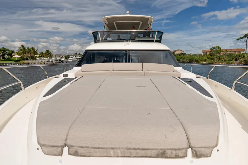 Slide: The Image of 2026 Absolute 60 Fly yacht with spacious deck, cruising on a sunny day. - 53