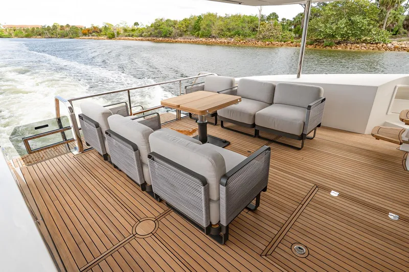Slide: The Image of Luxurious deck seating on 2026 Absolute 60 Fly yacht, featuring elegant wooden flooring. - 6