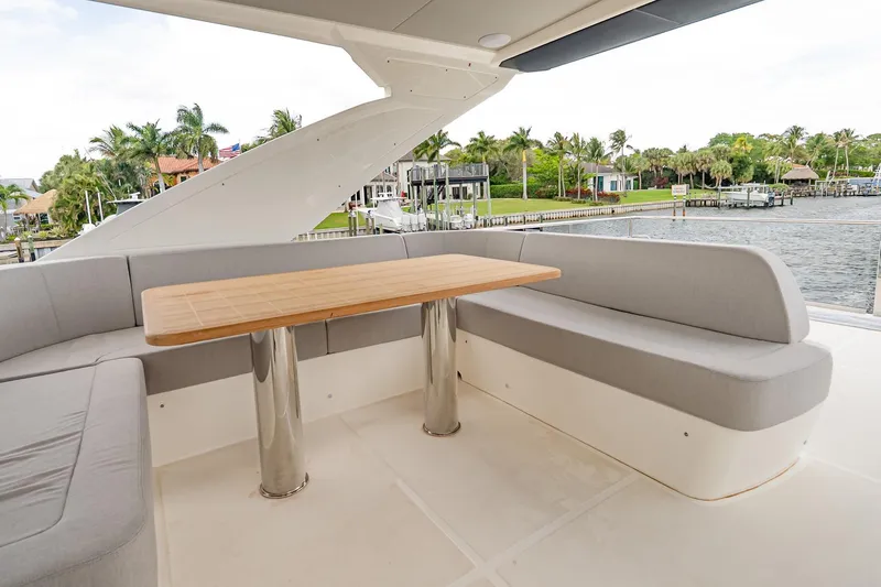 Slide: The Image of Luxurious seating area on 2026 Absolute 60 Fly yacht with waterfront view. - 62