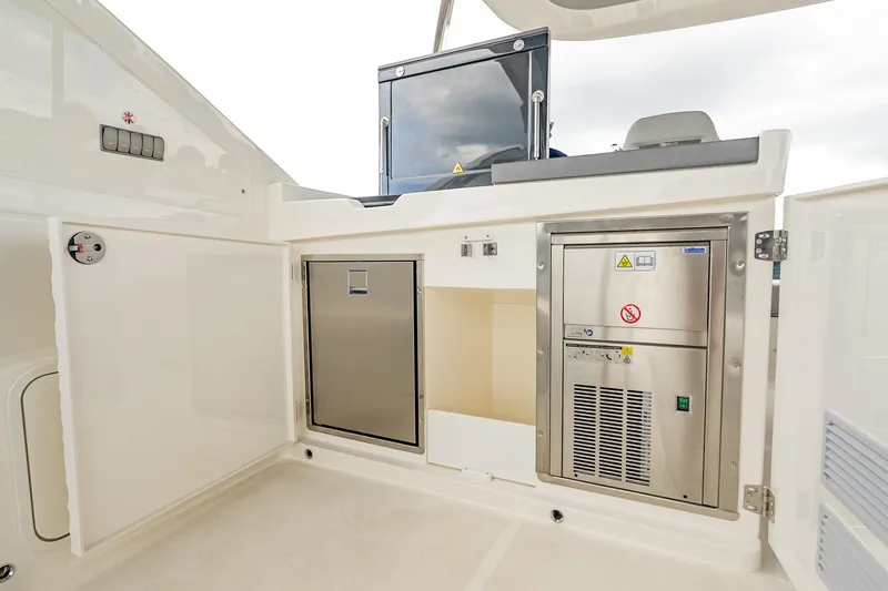 Slide: The Image of Luxurious Absolute 60 Fly yacht interior, featuring modern stainless steel appliances, 2026 model. - 63