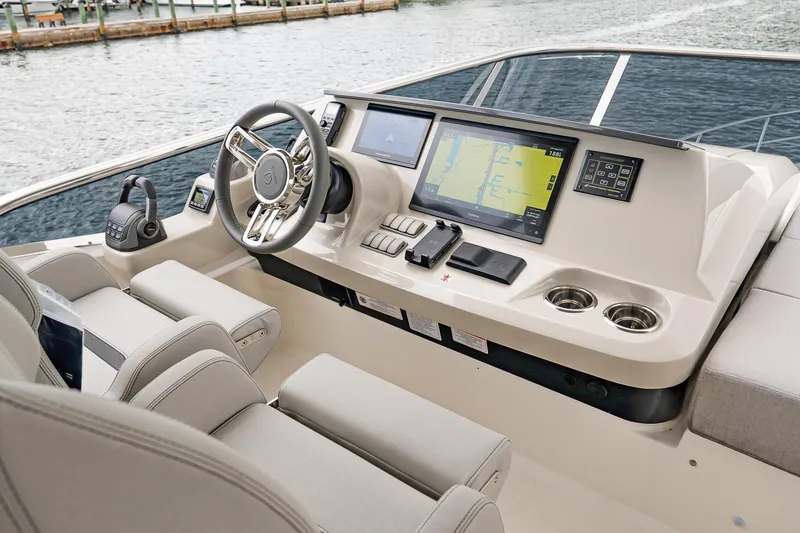 Slide: The Image of Helm of 2026 Absolute 60 Fly yacht with advanced navigation displays and controls. - 67