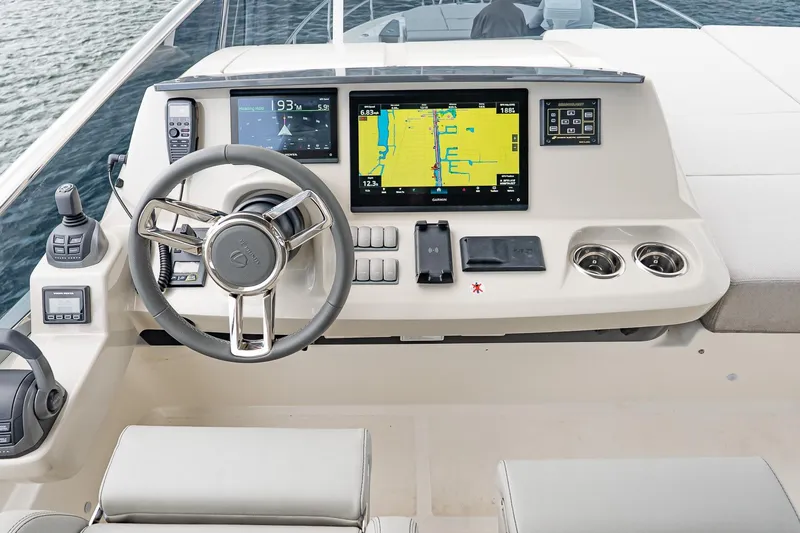 Slide: The Image of Helm of 2026 Absolute 60 Fly yacht with advanced navigation displays and controls. - 68