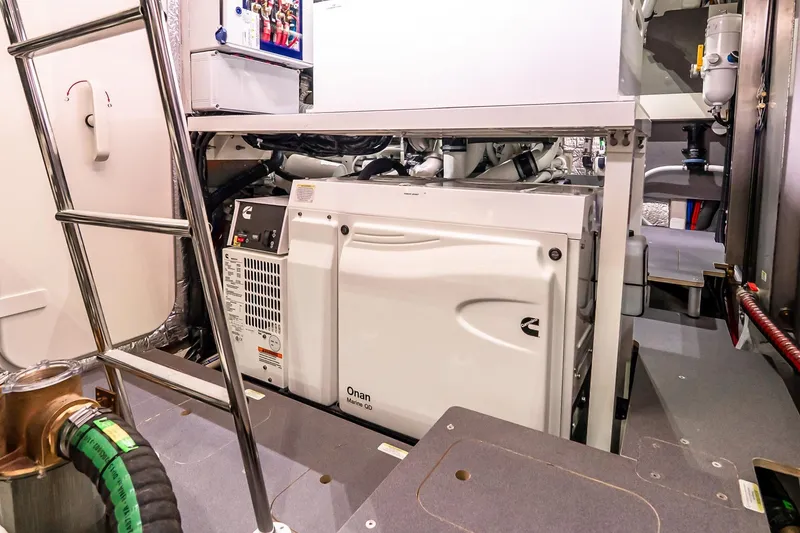 Slide: The Image of Engine room of 2026 Absolute 60 Fly yacht featuring Onan Marine generator. - 72
