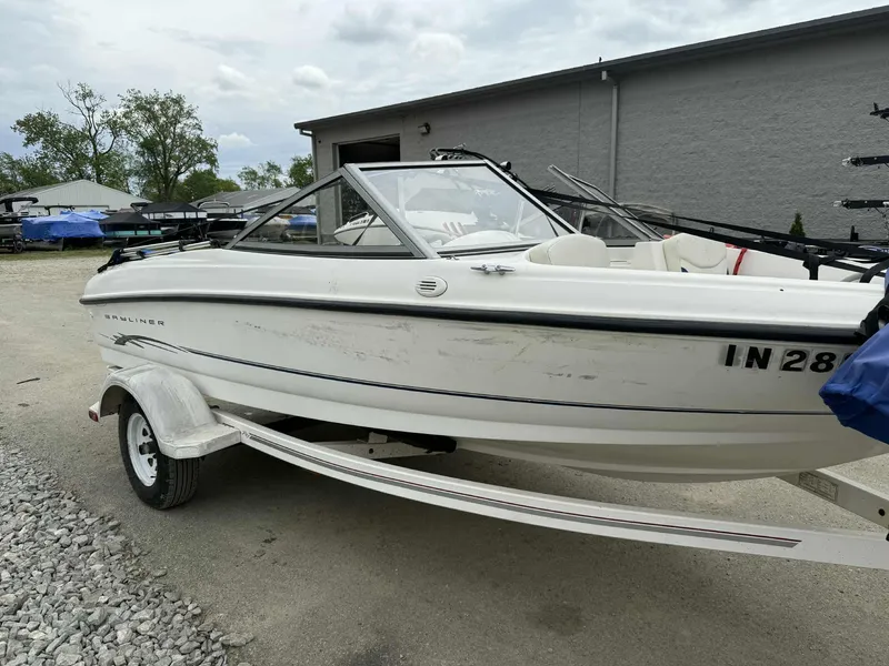 Slide: The Image of 2005 Bayliner 175 Bowrider on trailer, parked outdoors near a building. - 5
