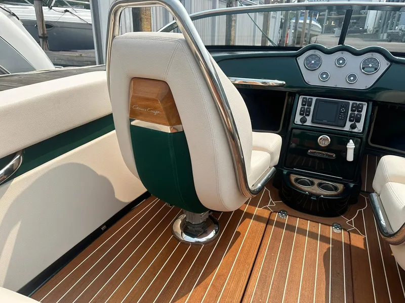 Slide: The Image of 2018 Chris-Craft Capri 21 interior with elegant dashboard and luxurious seating. - 10