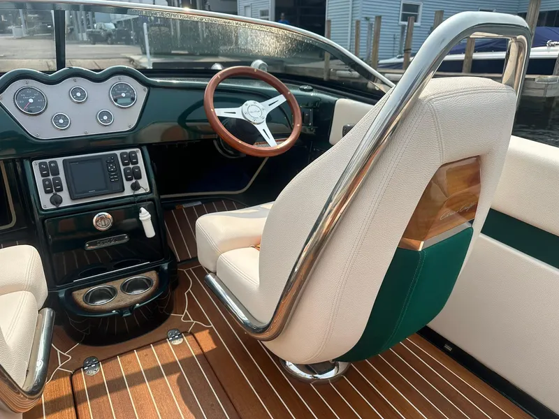 Slide: The Image of 2018 Chris-Craft Capri 21 interior with elegant dashboard and luxurious seating. - 11