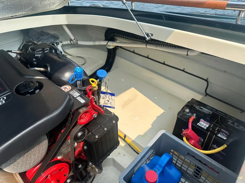Slide: The Image of Engine compartment of a 2018 Chris-Craft Capri 21 boat, showing engine and battery. - 20
