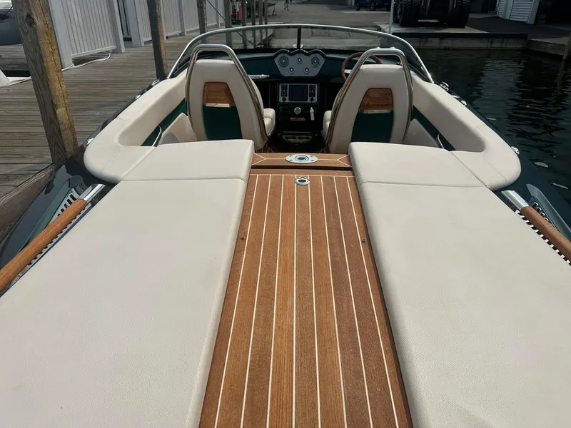 Slide: The Image of 2018 Chris-Craft Capri 21 boat interior with elegant wood and leather seating. - 8