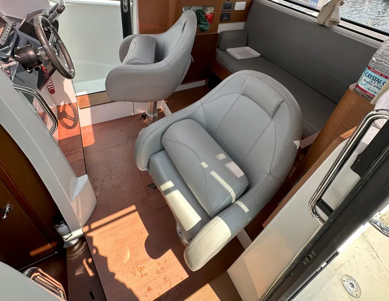 Slide: The Image of Interior of 2012 Beneteau Barracuda 9 Fly with modern seating and steering wheel. - 17