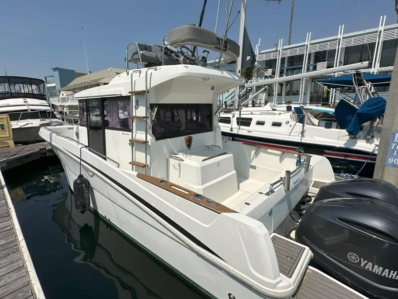 Slide: The Image of 2012 Beneteau Barracuda 9 Fly boat docked at marina with Yamaha engines. - 2