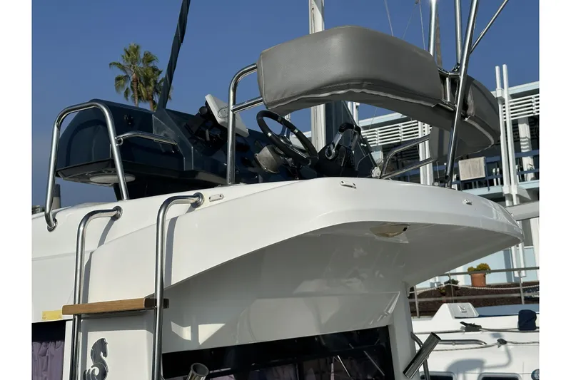 Slide: The Image of 2012 Beneteau Barracuda 9 boat with upper helm station and ladder, docked in marina. - 6