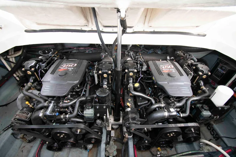 Slide: The Image of Twin engines of a 2004 Sea Ray 290 Sun Sport boat. - 16