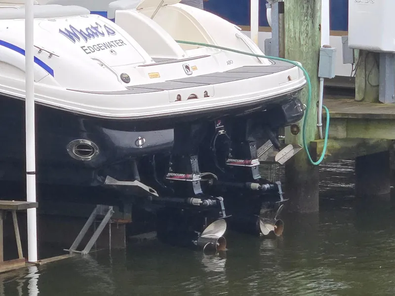 Slide: The Image of 2004 Sea Ray 290 Sun Sport docked with dual Mercury outboard engines. - 17