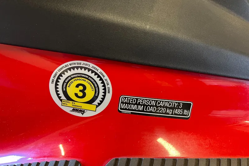 Slide: The Image of 2019 Yamaha WaveRunner EX Deluxe capacity label, red body, rated for 3 persons, 220 kg load. - 8