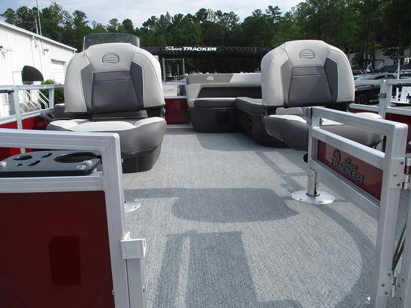 Slide: The Image of 2026 Sun Tracker Bass Buggy 16 XL Select pontoon boat interior with seating and carpeted deck. - 11
