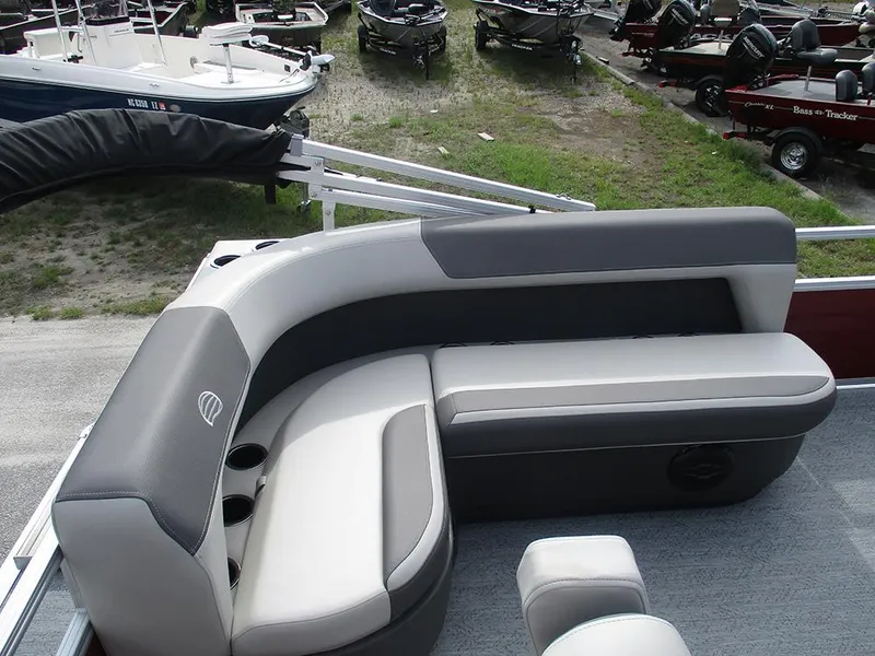 Slide: The Image of 2026 Sun Tracker Bass Buggy 16 XL Select pontoon boat seating area with cup holders. - 12