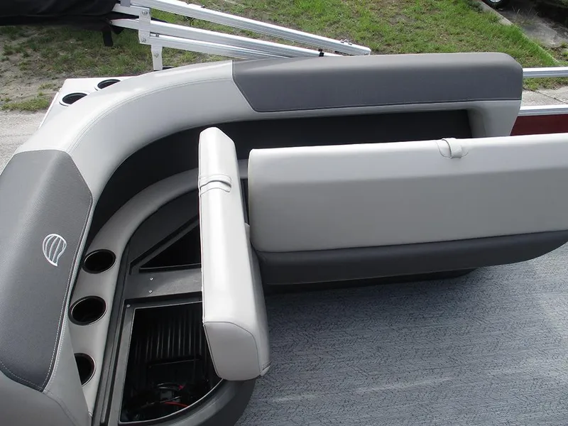 Slide: The Image of 2026 Sun Tracker Bass Buggy 16 XL Select boat seating with storage and cup holders. - 13