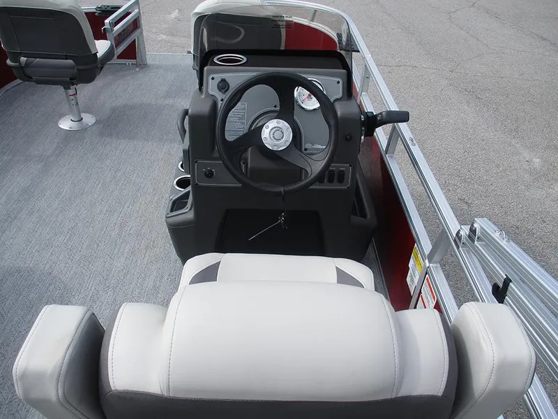 Slide: The Image of 2026 Sun Tracker Bass Buggy 16 XL Select boat interior with steering console and seating. - 16
