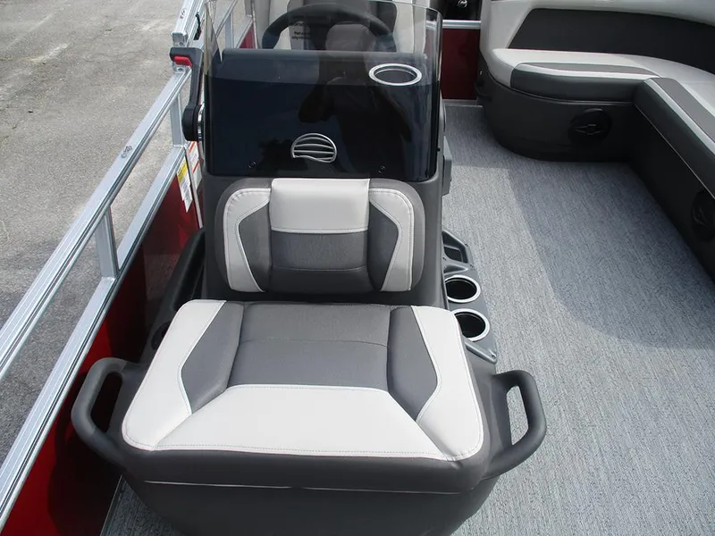 Slide: The Image of 2026 Sun Tracker Bass Buggy 16 XL Select interior with seating and console. - 18