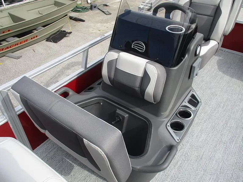 Slide: The Image of 2026 Sun Tracker Bass Buggy 16 XL Select interior with seating and console. - 19