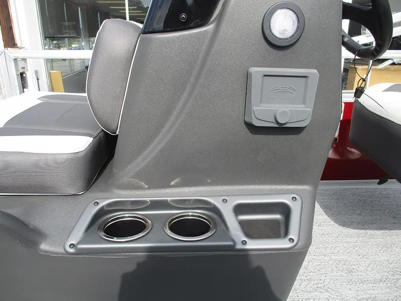 Slide: The Image of 2026 Sun Tracker Bass Buggy 16 XL Select console with cup holders and storage compartment. - 27