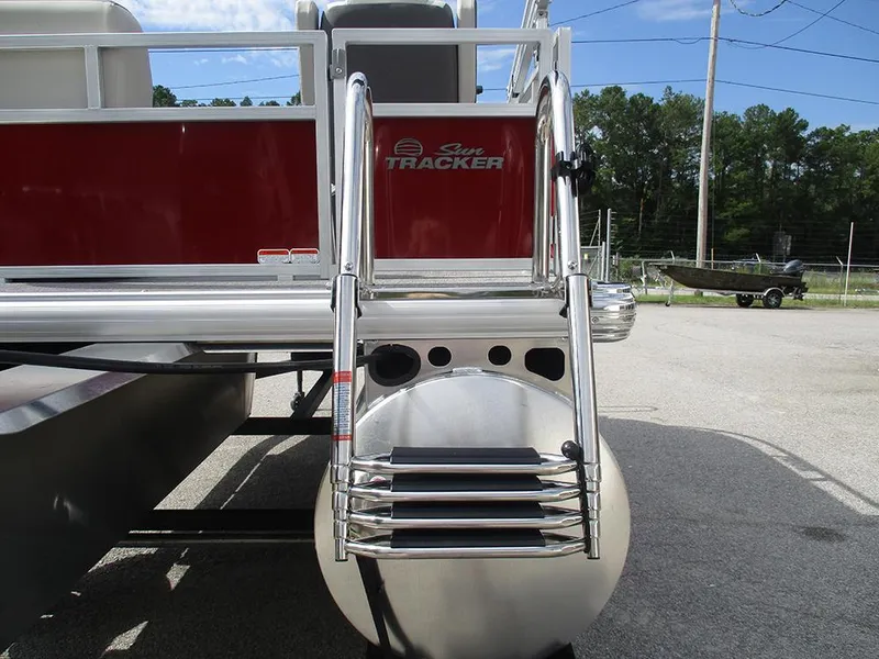 Slide: The Image of 2026 Sun Tracker Bass Buggy 16 XL Select pontoon boat rear view with ladder. - 29