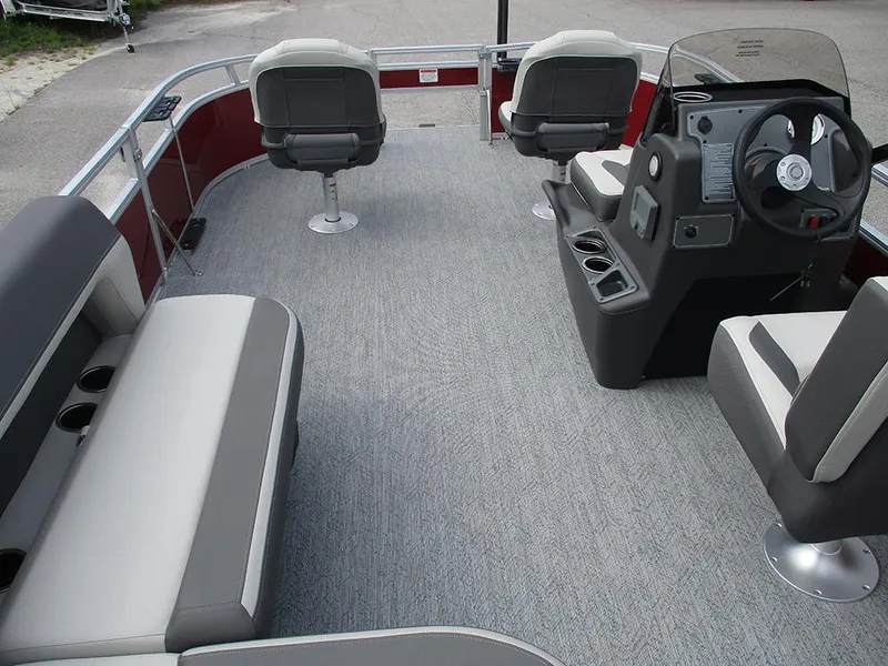 Slide: The Image of 2026 Sun Tracker Bass Buggy 16 XL Select pontoon boat interior with seating and steering console. - 31