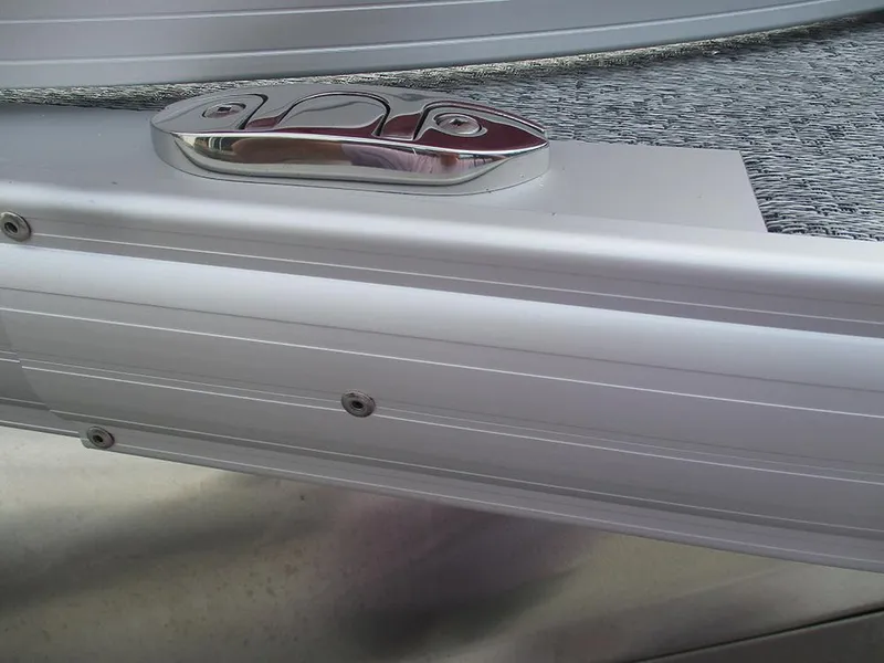 Slide: The Image of Close-up of 2026 Sun Tracker Bass Buggy 16 XL Select boat detail, featuring sleek metal finish. - 32