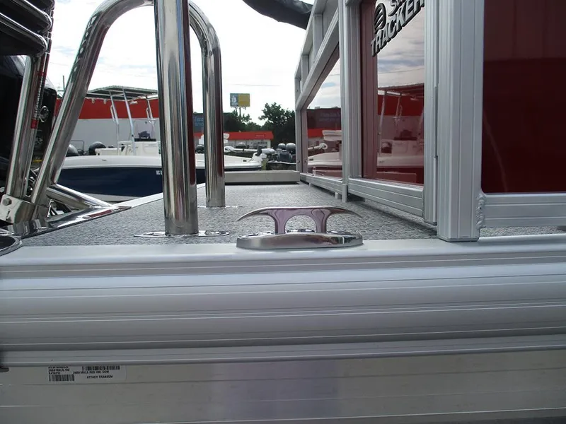 Slide: The Image of 2026 Sun Tracker Bass Buggy 16 XL Select pontoon boat deck with railing and cleat. - 35