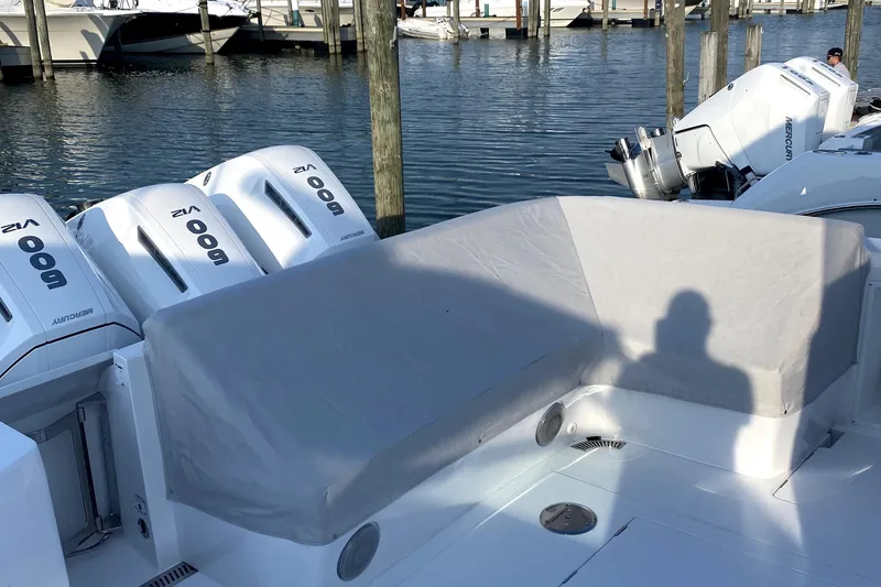 Slide: The Image of Luxurious seating area with wooden table on 2025 Intrepid 50 Evolution boat. - 13