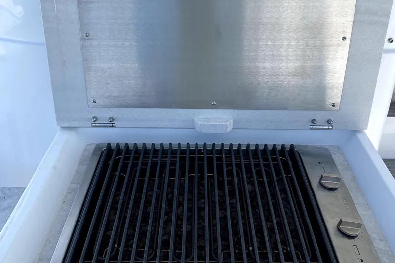 Slide: The Image of Intrepid 50 Evolution 2025 yacht refrigerator with drinks and storage. - 15