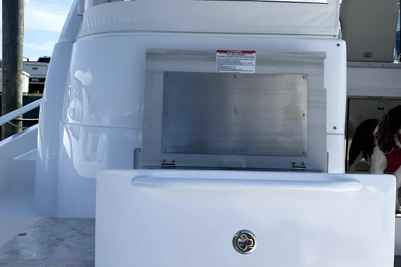 Slide: The Image of Outdoor grill on 2025 Intrepid 50 Evolution yacht, featuring stainless steel design. - 16