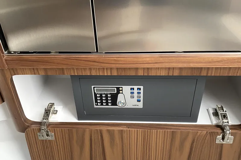 Slide: The Image of Cozy cabin interior of 2025 Intrepid 50 Evolution yacht with window view. - 23