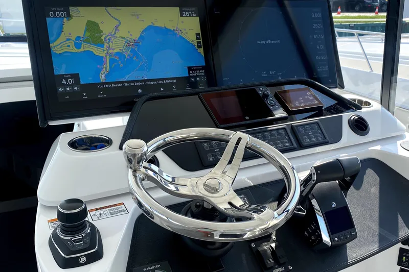 Slide: The Image of 2025 Intrepid 50 Evolution yacht docked at marina, American flag in background. - 3