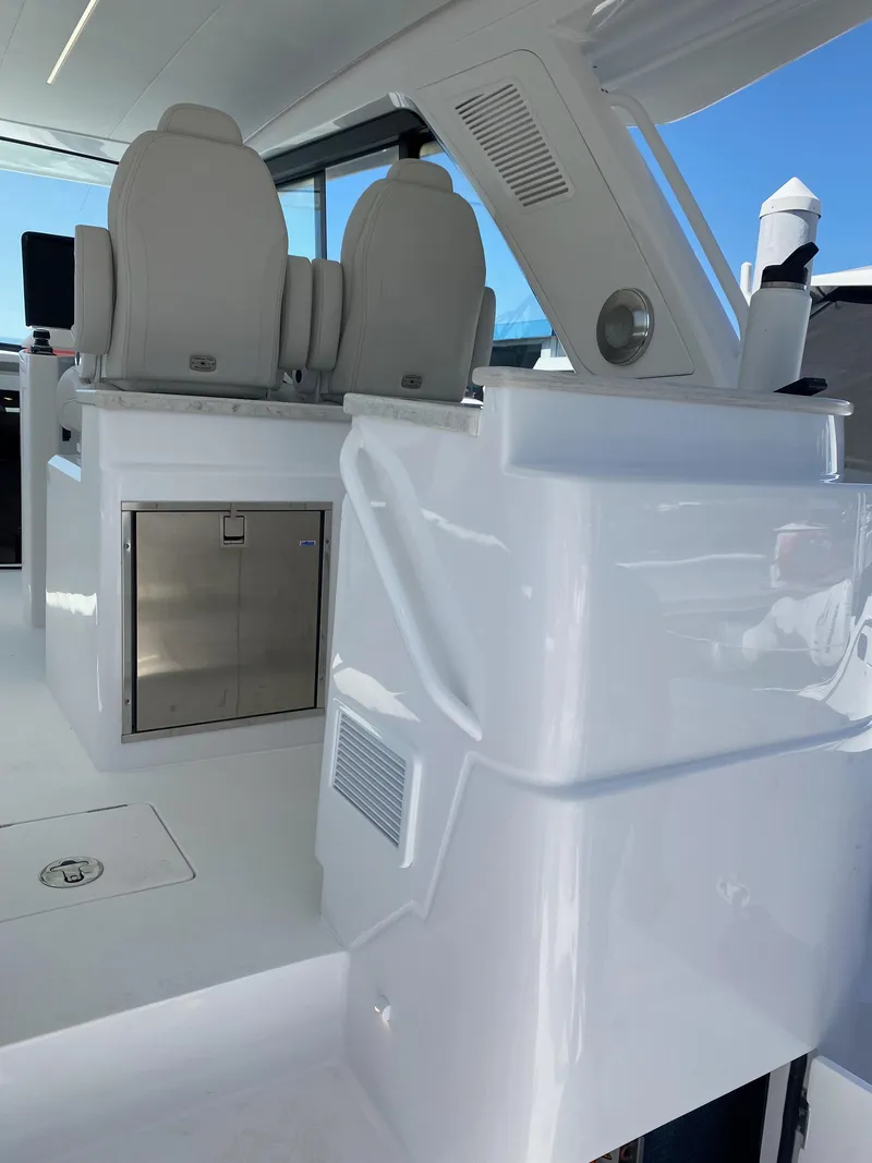 Slide: The Image of Helm of 2025 Intrepid 50 Evolution with advanced navigation displays and controls. - 5