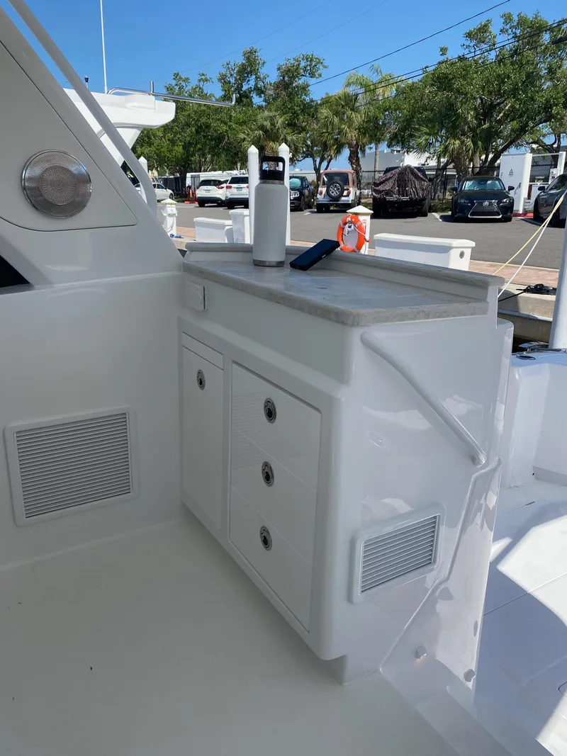 Slide: The Image of Luxury seating in 2025 Intrepid 50 Evolution yacht cockpit, featuring sleek white design. - 6