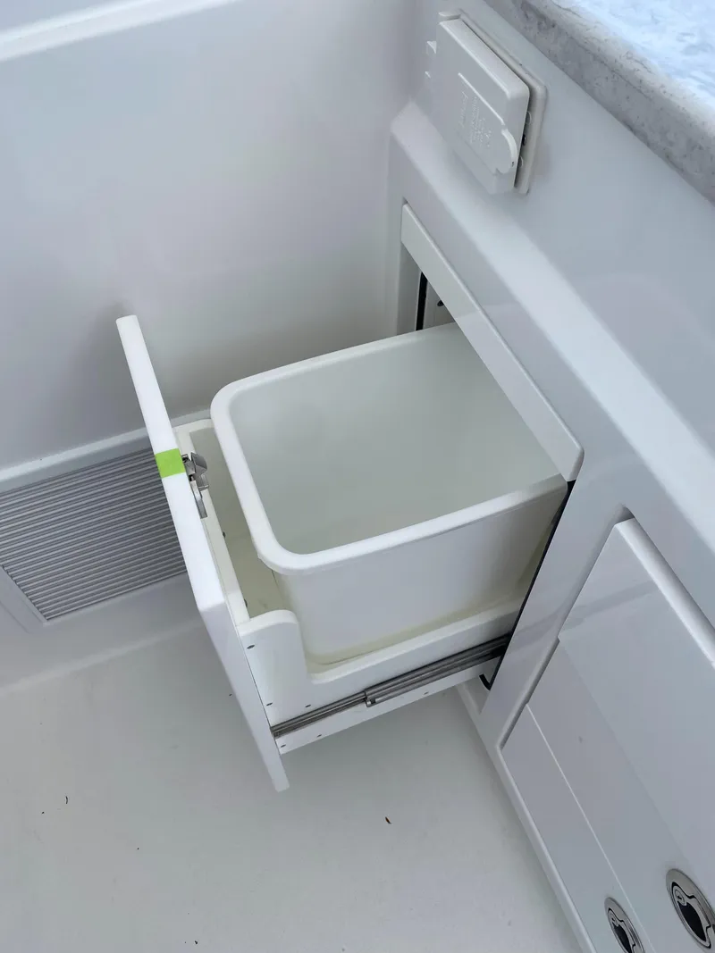 Slide: The Image of Interior of 2025 Intrepid 50 Evolution yacht, featuring sleek white seating and modern design elements. - 7