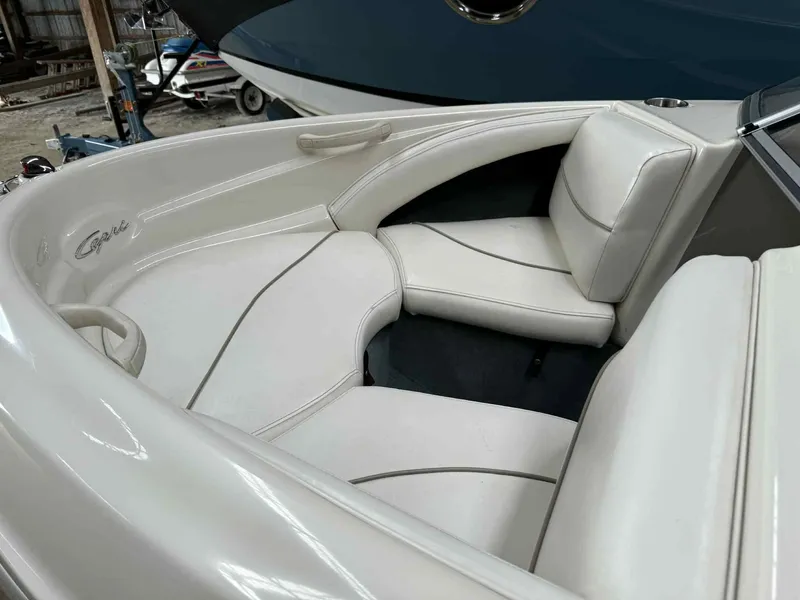 Slide: The Image of Bayliner 1750 Capri DX 2000 boat interior with white cushioned seating. - 3