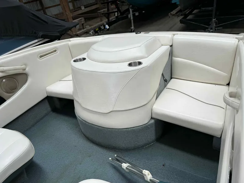 Slide: The Image of Interior of 2000 Bayliner 1750 Capri DX boat with white seating and cup holders. - 6