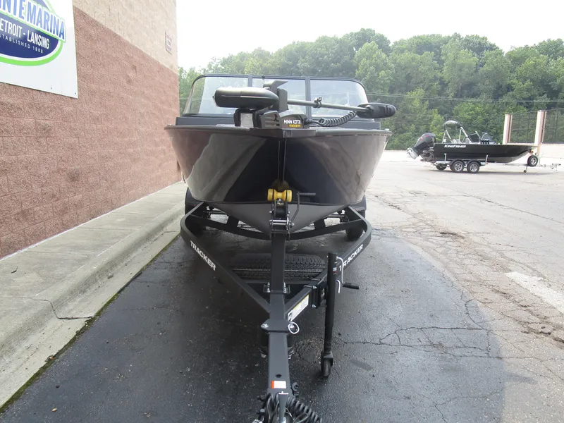 Slide: The Image of 2026 Tracker Pro Guide V175 CB boat on trailer at marina parking lot. - 8